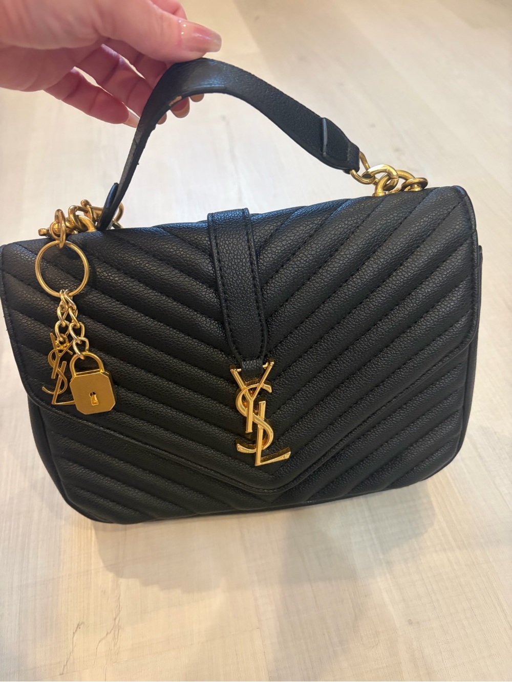 Black Quilted Leather Top-Handle Bag with Gold Hardware